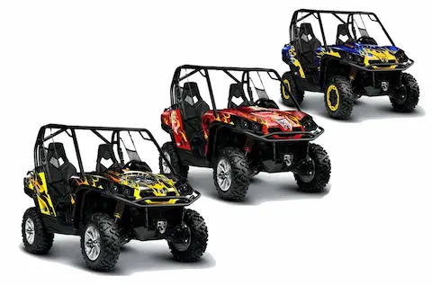 Three Can-Am Commanders with custom flame graphic kits in yellow, red and blue